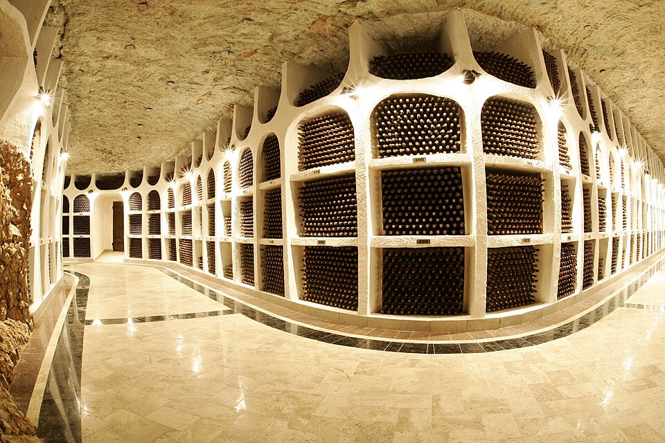Underground gallery at Cricova lined with arched racks of stacked wine bottles